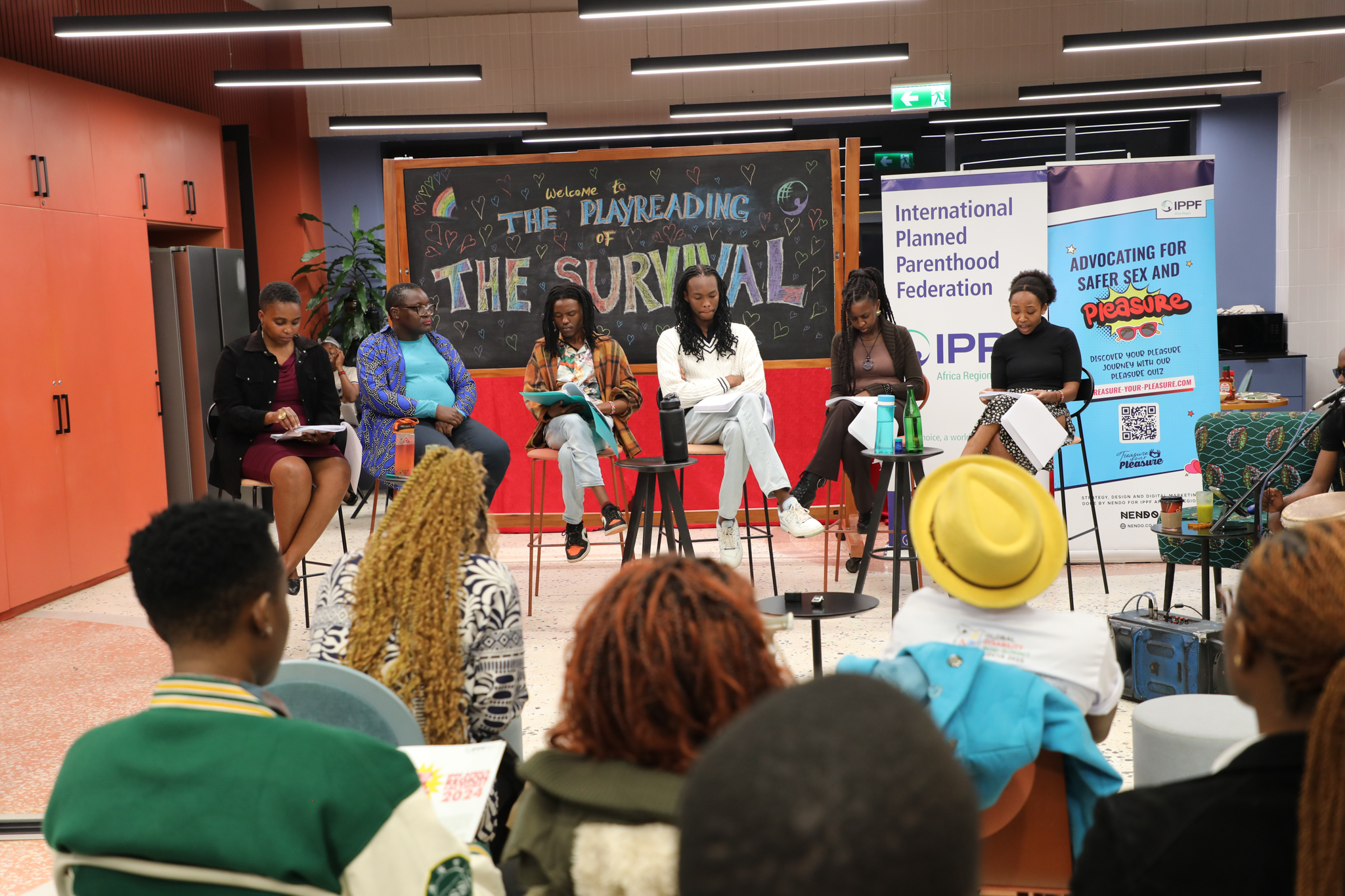 Participants listen as The Survival is read aloud in a powerful moment of shared reflection and resistance.