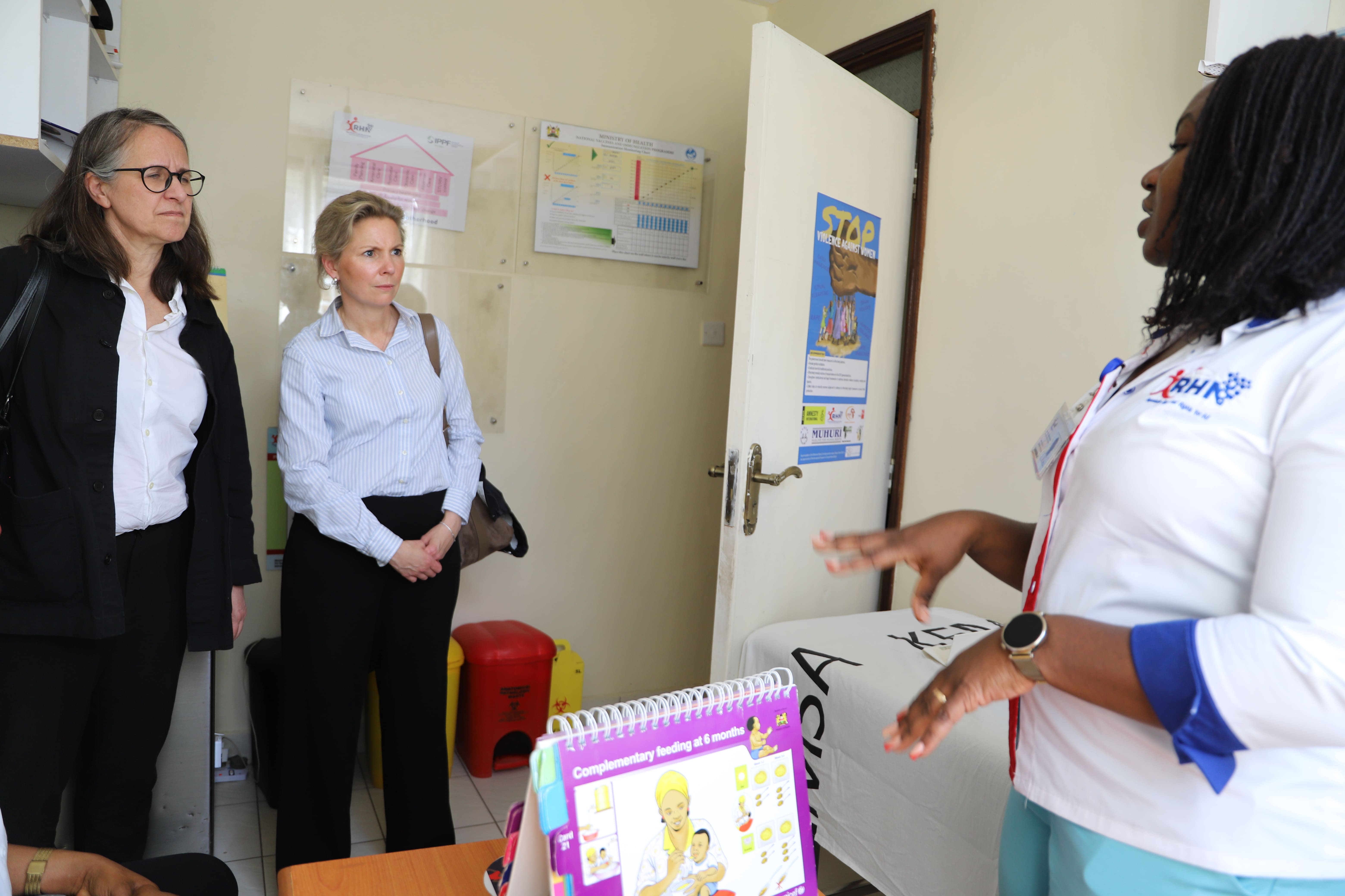 Ms. Nancy Lynn Kavuka, RHNK Service Delivery Manager (right), takes the Sida team through the operations at the REHNET Medical Center