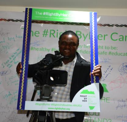 A Ghanian Journalist poses with the #RightByHer 