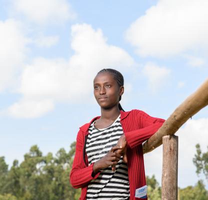 Hawwii, 14, poses outside of a primary school in Wonchi Woreda in Ethiopia_Images of Empowerment library_by Getty Images photographer Maheder Haileselassie Tadese 