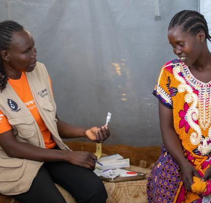 Joyce Chrispo, 34, consults Rose Nyoka Alphonso from RHASS South Sudan on how different type of family planning methods 