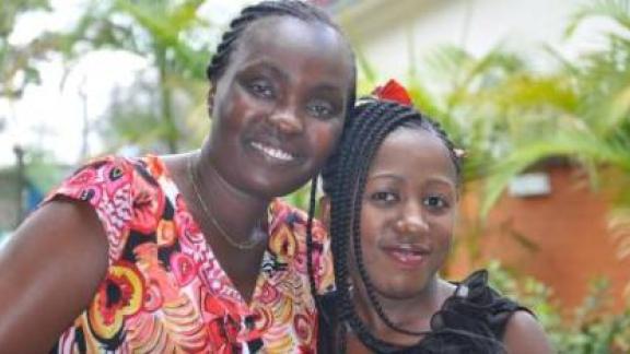 Beatrice Nguo with a young girl