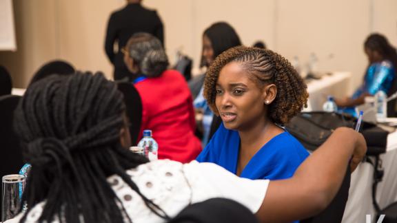 Josephine speaking to a fellow member of the Journalist Network during an Advocacy Meeting in Nairobi