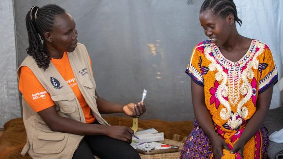 Joyce Chrispo, 34, consults Rose Nyoka Alphonso from RHASS South Sudan on how different type of family planning methods 
